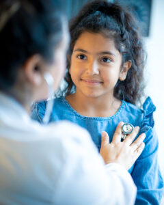 Doctor Listening to a Young Girls Heart